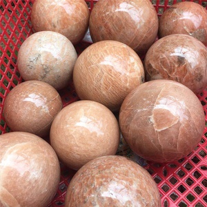 Multiple polished round peach moonstone balls